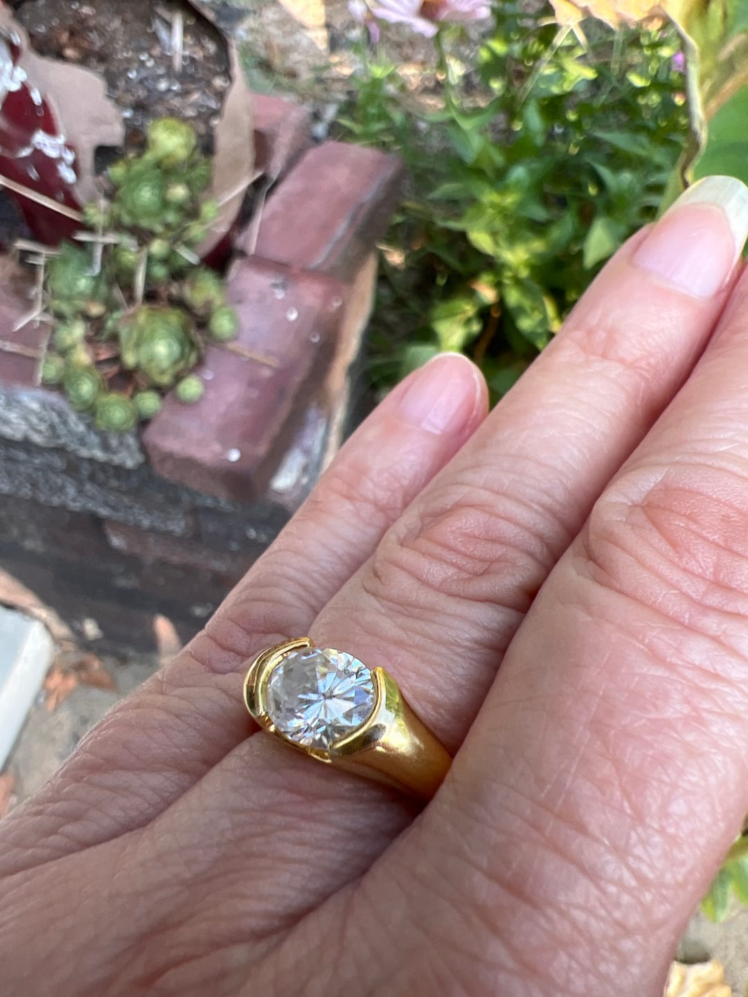 Customer photo review of Solitaire Oval Moissanite Half Bezel Set Engagement Ring