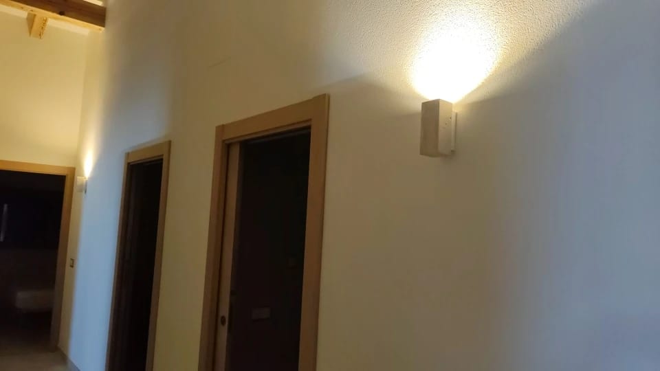 Customer photo review of Wabi-Sabi Travertine Wall Lamp
