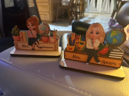 Customer's two personalized Teacher Sweet Desk Nameplates displayed on a white surface.