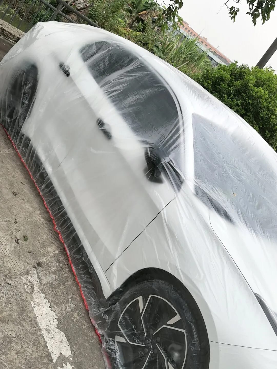 Customer photo review of All-Weather Disposable PE Car Cover – Indoor/Outdoor Dust & Rain Protection