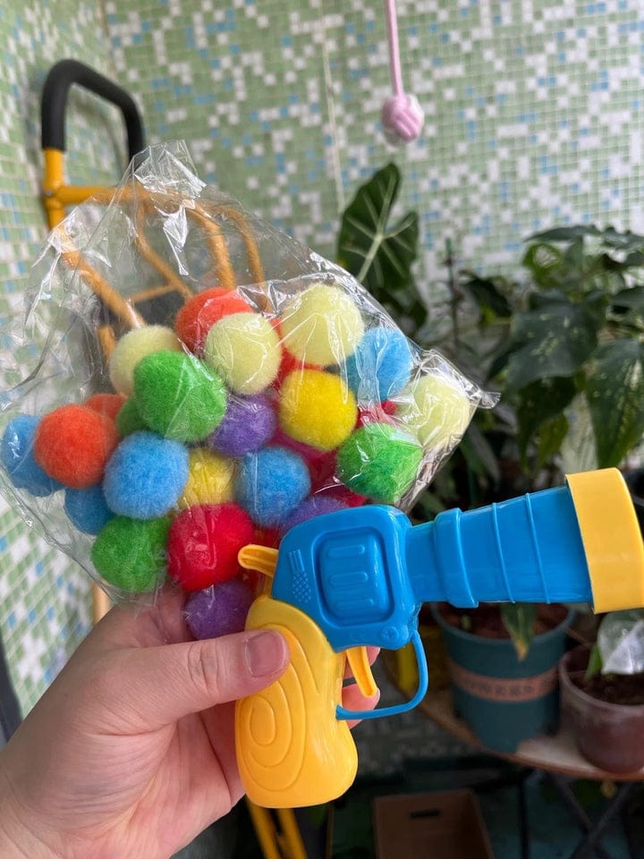 Customer photo review of Calming Puff Launcher (100 x soft fuzzy puff balls)