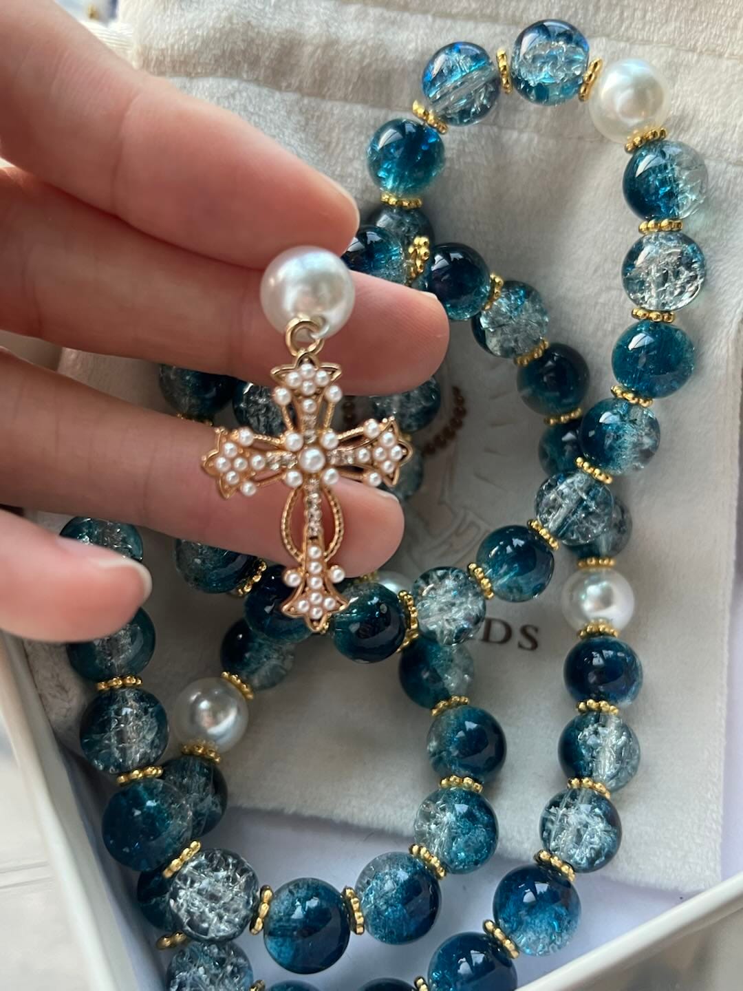 Customer photo review of SolaceBeads Gradient Ocean Crackle Glass Rosary & Pearl Embedded Cross: Rooted in Guadalupe Faith