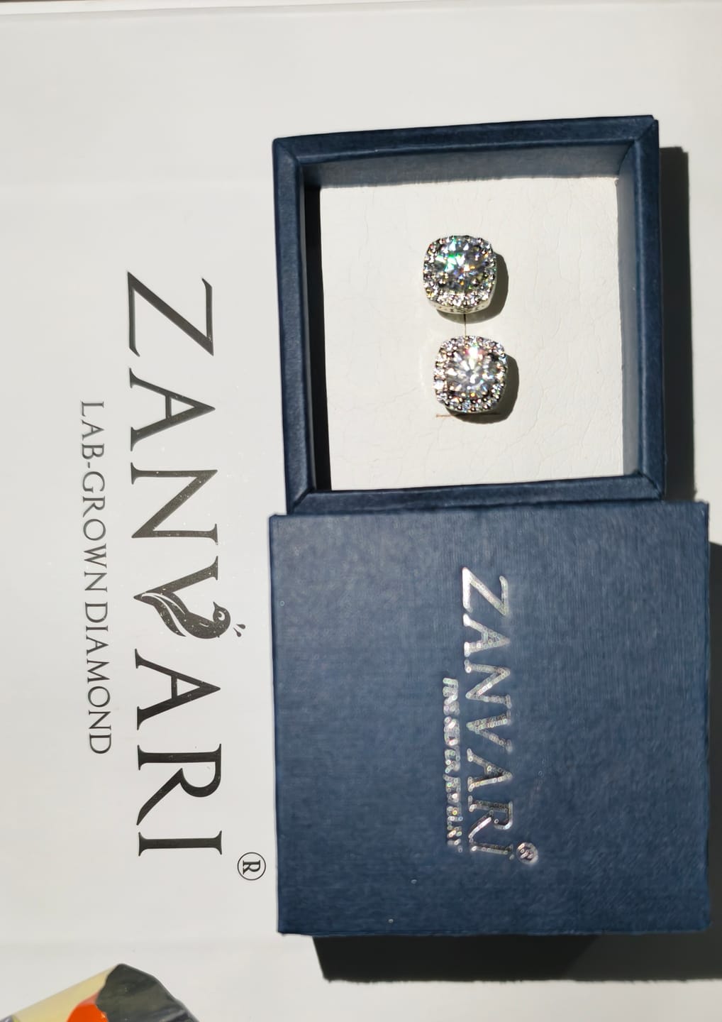 Customer photo review of D'Amour Clarity Studs — 2ct GRA Certified Moissanite Halo Studs in Sterling Silver