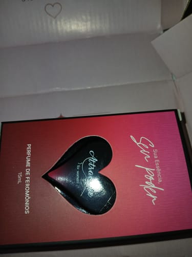 Customer's Attracione Sensual perfume box featuring a pink and red gradient design with a heart cutout.