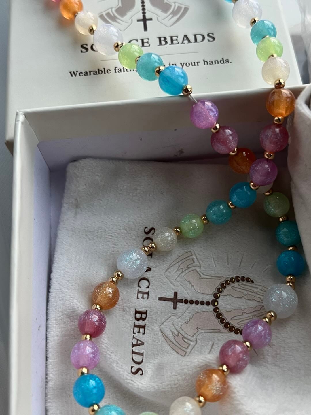 Customer photo review of Solacebeads Rainbow Cat Eye Artistic Rosary With Rhinestone Crucifix: The Timeless Devout Faith