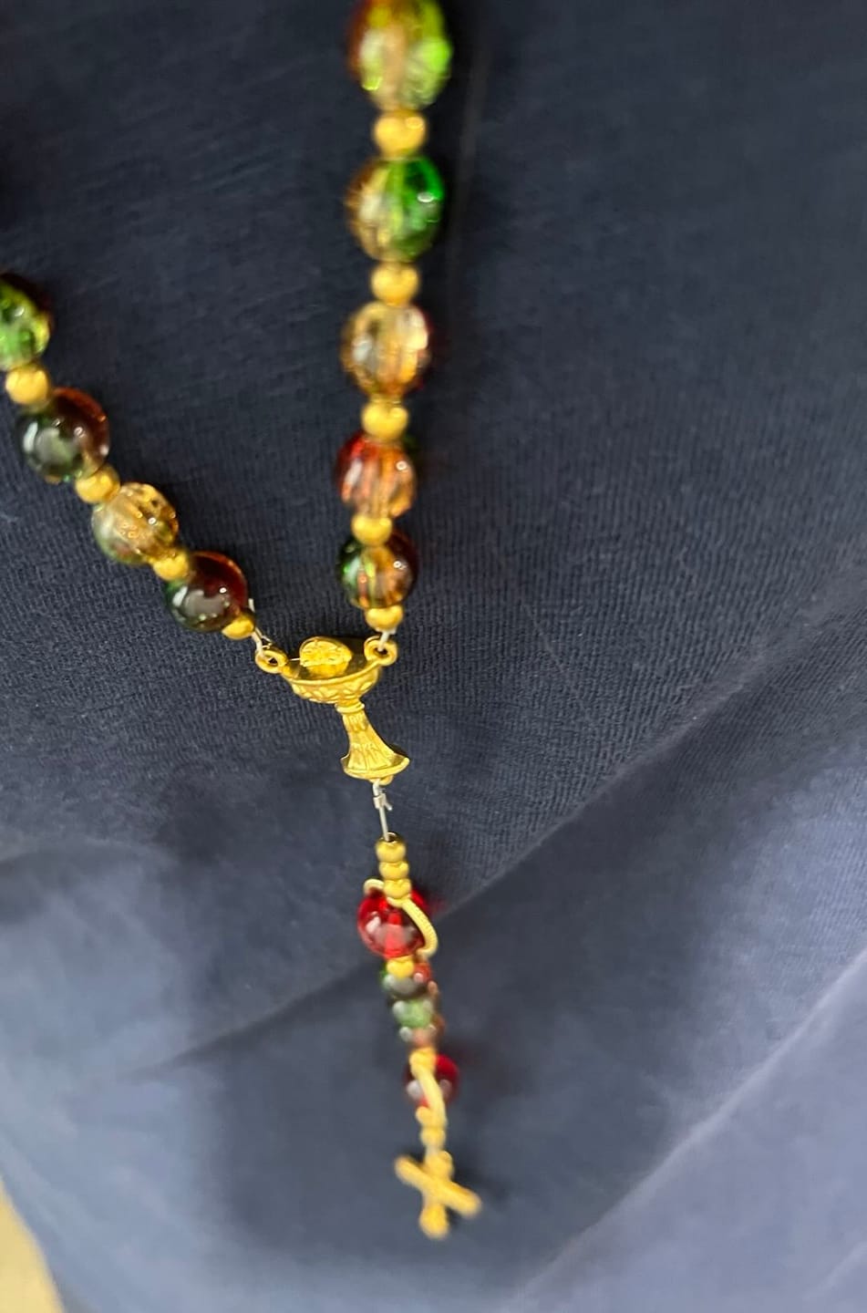 Customer photo review of SolaceBeads Color Glass Rosary, Red Transparent Spacers & Gold Charms: Dazzling Bright Daily Devotion