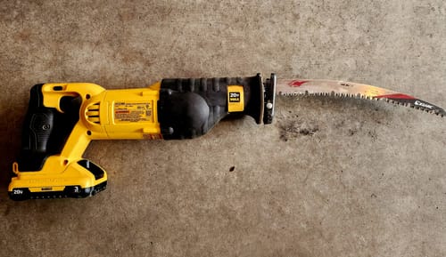 Customer's ProCut reciprocating saw blade attached to a yellow cordless saw.