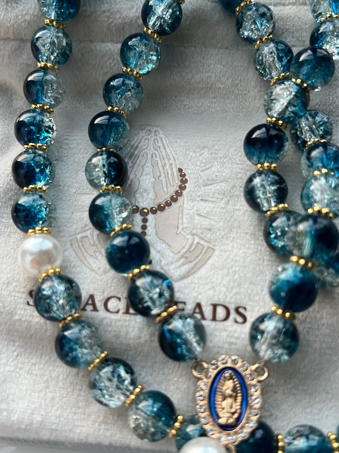 Customer photo review of SolaceBeads Gradient Ocean Crackle Glass Rosary & Pearl Embedded Cross: Rooted in Guadalupe Faith