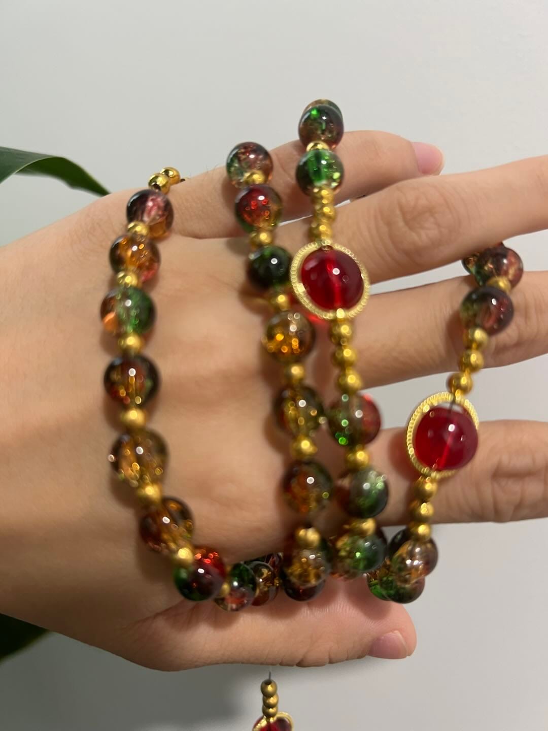 Customer photo review of SolaceBeads Color Glass Rosary, Red Transparent Spacers & Gold Charms: Dazzling Bright Daily Devotion