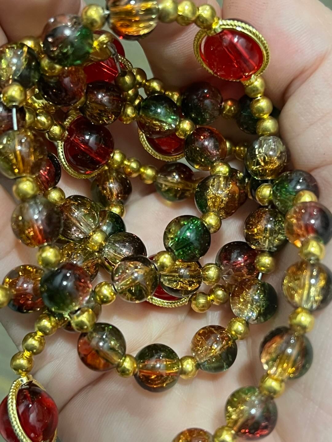 Customer photo review of SolaceBeads Color Glass Rosary, Red Transparent Spacers & Gold Charms: Dazzling Bright Daily Devotion
