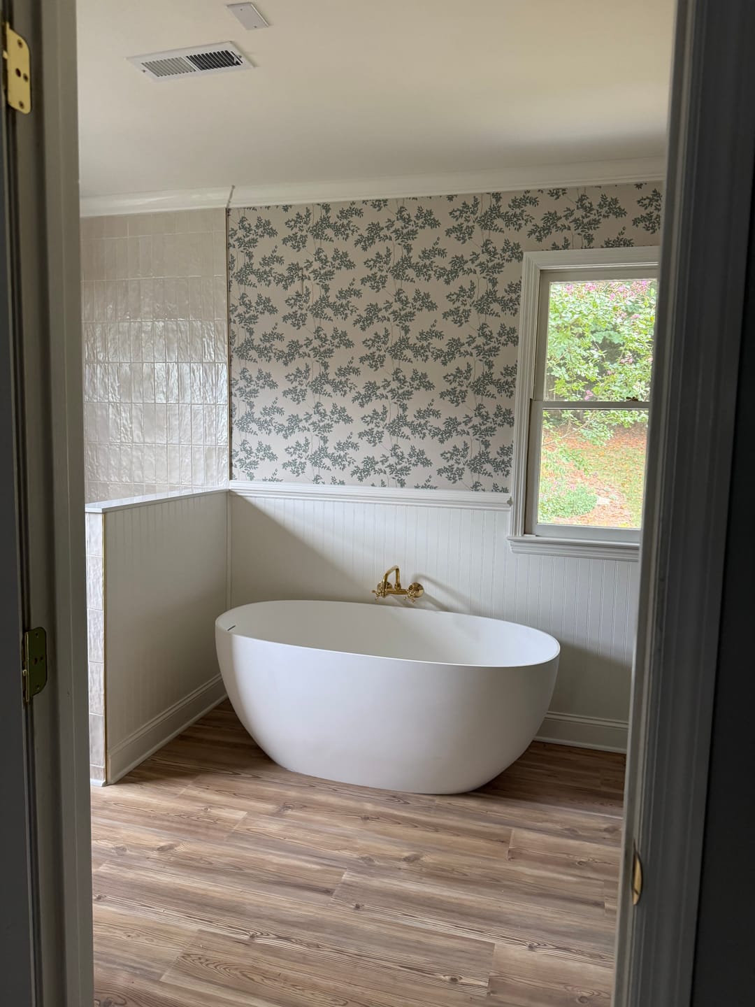 Customer photo review of Curved Wall Mount Faucet