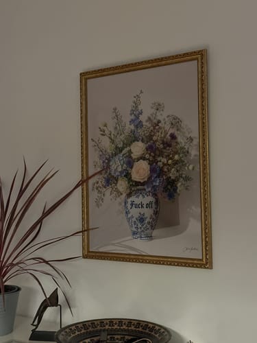 Customer's Boundaries art print in a gold frame, hanging on a wall above a decorative bowl.