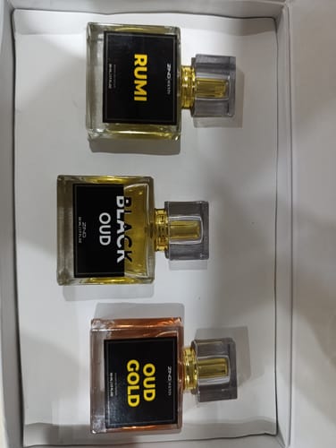 Customer's OUD Supreme Bundle gift set containing three square glass perfume bottles with black labels inside a box.