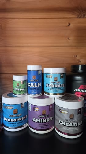 Customer's UGLYFACE CALM supplement bottle shown alongside other various UGLYFACE fitness supplement containers.