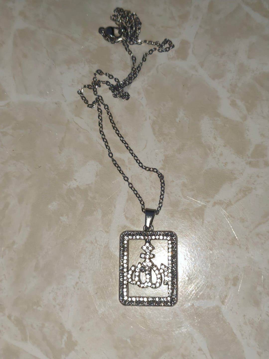 Customer photo review of HilalHaven Geometric Verse Contour Allah Crystal Framed Cutout Letter Pendant Necklace