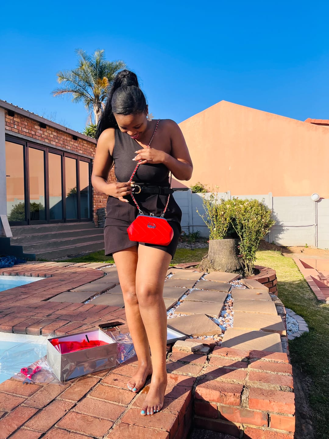 Customer photo review of ERA Mini Kisslock Chain Bag – Red