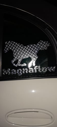 Customer's Custom Text Decal featuring a horse and text on a vehicle window with a diamond-plate pattern