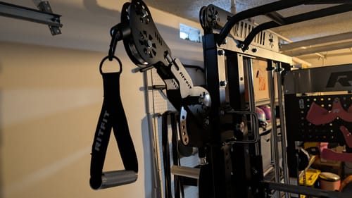 Customer's RitFit TAM1 Tornado Arm Attachment mounted on a black upright rack with a handle attachment hanging down.