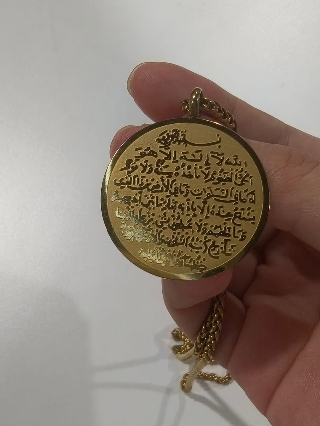 Customer photo review of HilalHaven Circle of Allah's Majesty Engraved Pendant Necklace — Polished Stainless Steel