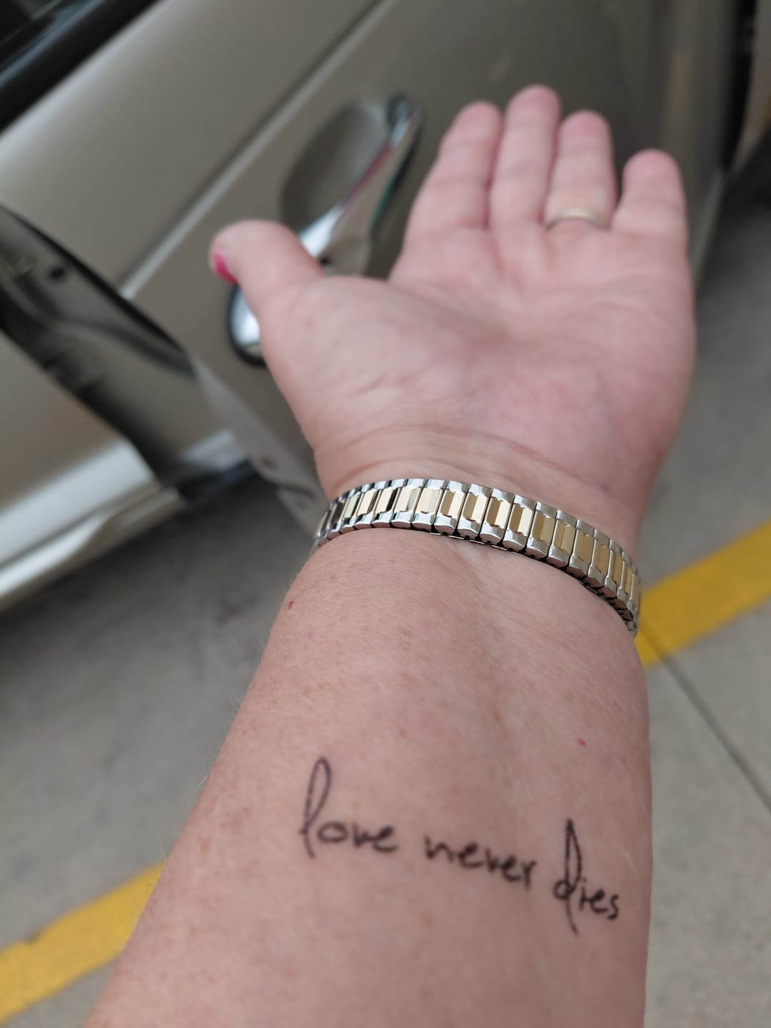 Customer photo review of Love Never Dies Tattoo