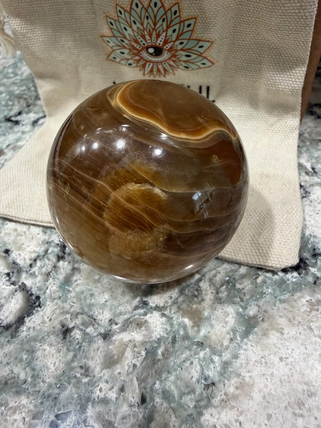Customer photo review of Calcite Brown Sphere – Grounded Energy and Earthy Calm