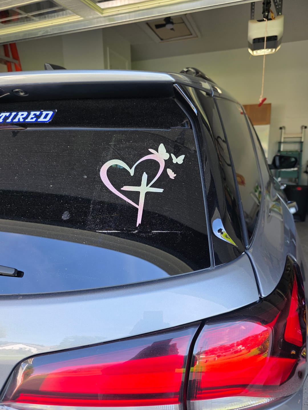 Customer photo review of Christianartworkshop  Glitter Heart Cross Butterfly Silhouette Waterproof Car Window Sticker: A Symbol of Sacred Love