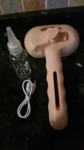 Customer photo review of Premium pet brush with steam function