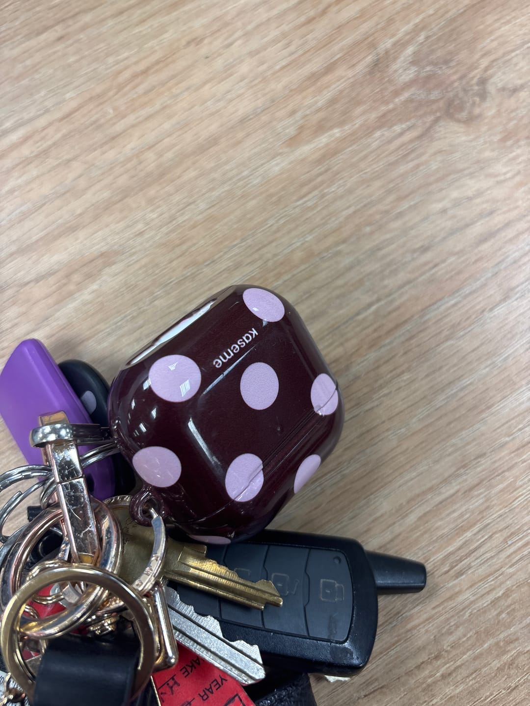 Customer photo review of Couture Burgundy AirPods Case