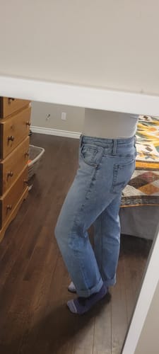 Customer's Silver Mid Rise Boyfriend Jean showing a relaxed fit and light wash from the side.