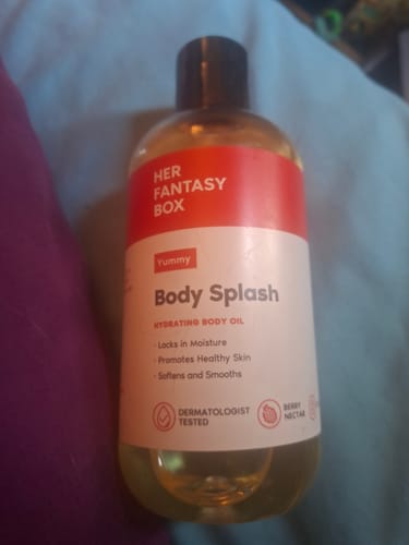Customer's Yummy Body Splash hydrating oil bottle, front label clearly visible