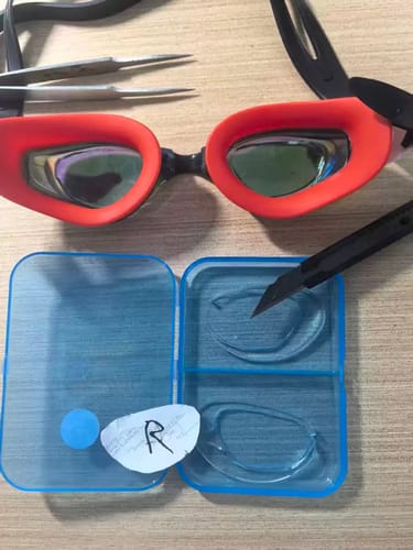 Customer photo of stick-on lenses fitted to swimming goggles