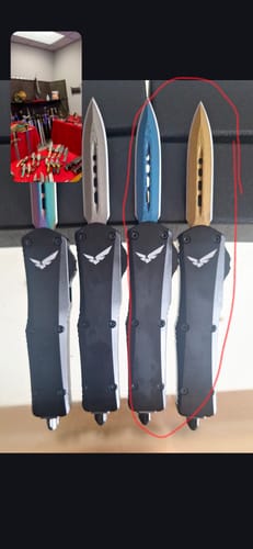 Customer's AtomStack A20 Pro laser-engraved knives with blue and gold blades, displaying precision metal work.