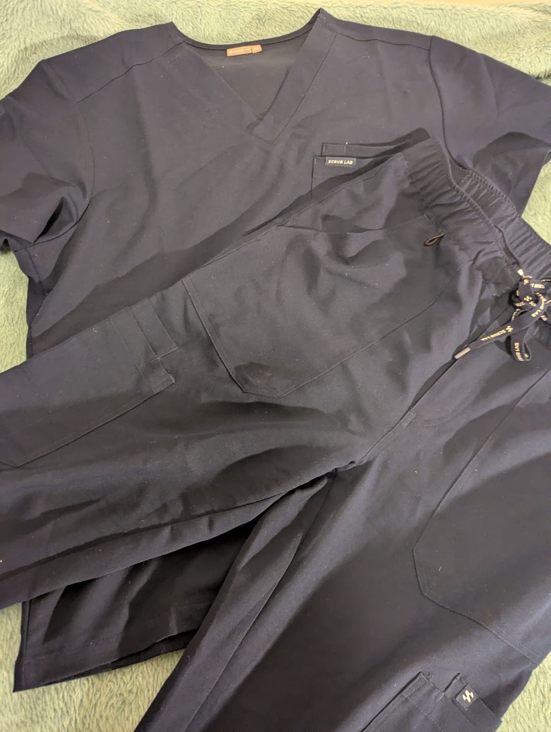 Customer photo review of WEARY Three Chest Pocket Scrub Top - Navy | SLTECH™