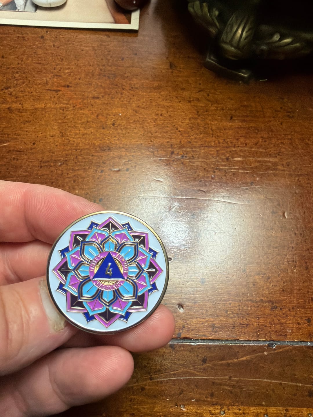 Customer photo review of 4 Year Sobriety Mint 'In Bloom' Lotus Flower Gold Plated AA Recovery Medallion - Four Year Chip/Coin - White