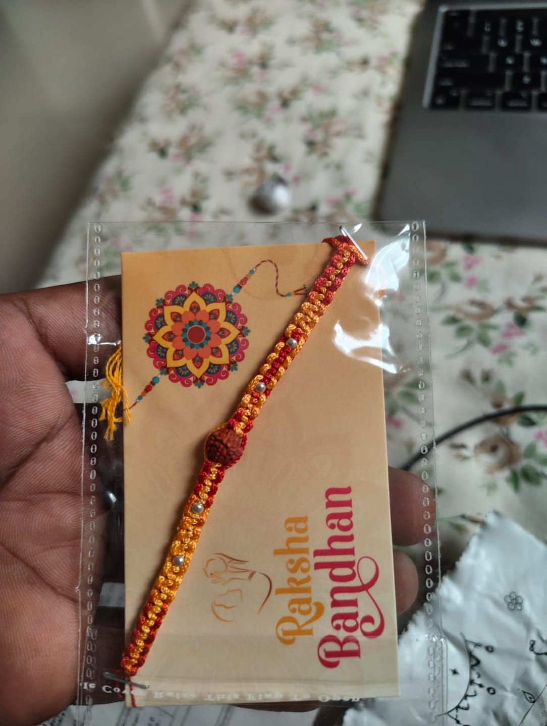 Customer photo review of Silver Rakhi for Brother Rudraksha & Bud Accents