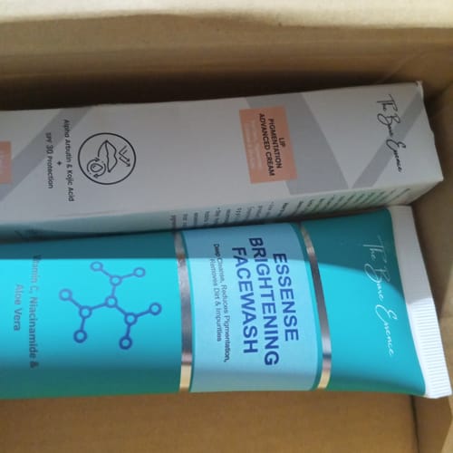 Customer's Lip Pigmentation Cream and Brightening Facewash from the bundle, positioned in a cardboard box.