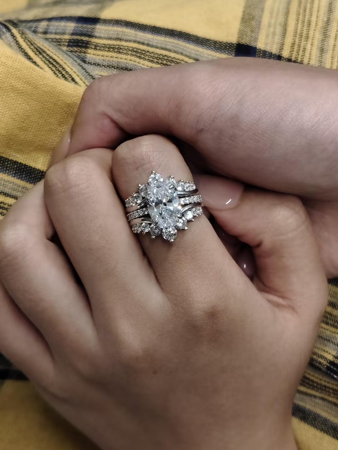 Customer photo review of Exclusive 4.0Ct/5.0Ct Oval Cut Hidden Halo 2PC Enhancer Wedding Ring Set in Sterling Silver