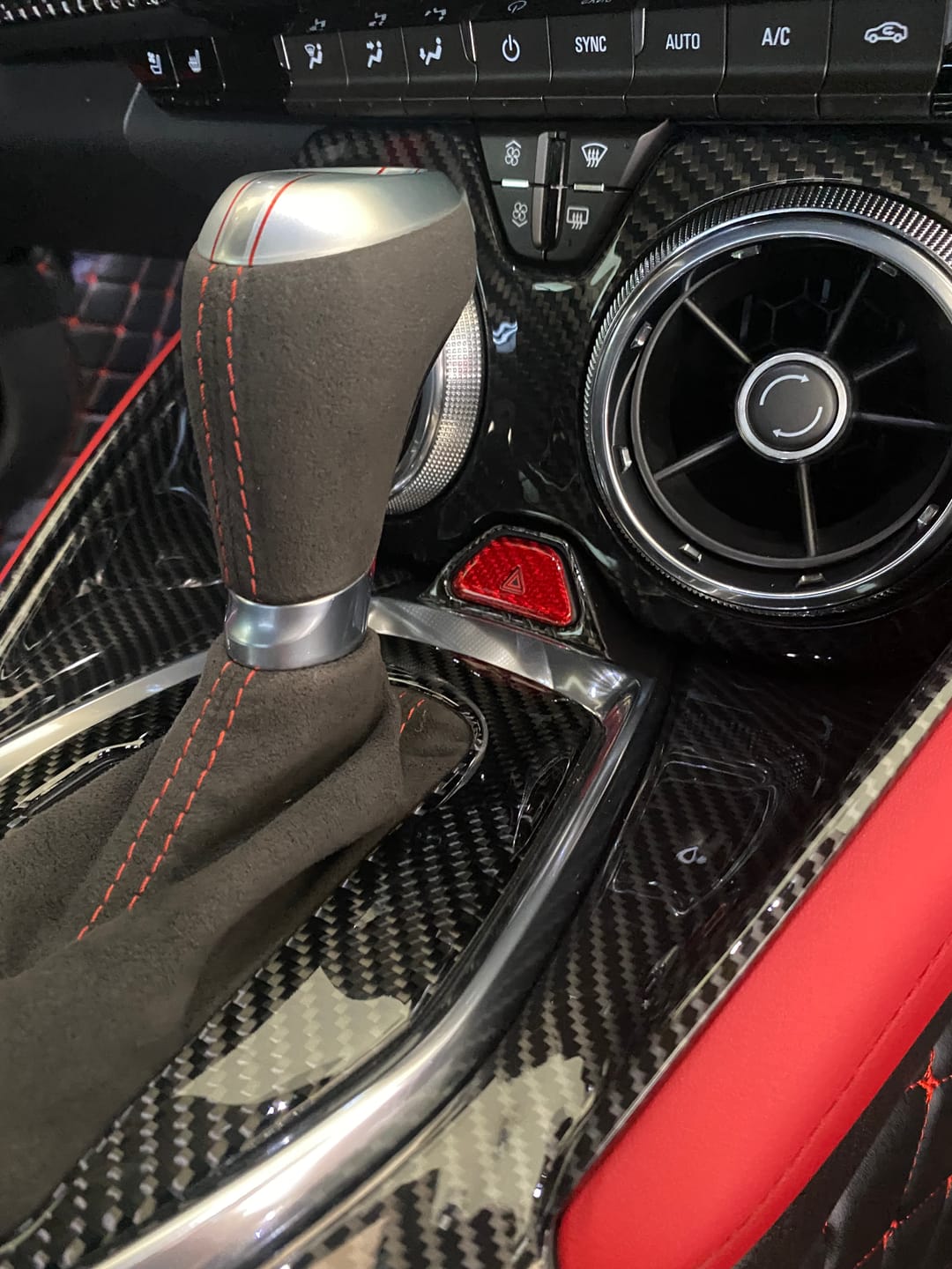 Customer photo review of 2016-2024 Chevy Camaro Real Carbon Fiber Interior Hazard Button Cover