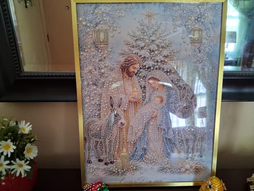 Customer's completed Holy Night Nativity Pearl Art DIY Kit in a gold frame displayed on a tabletop.