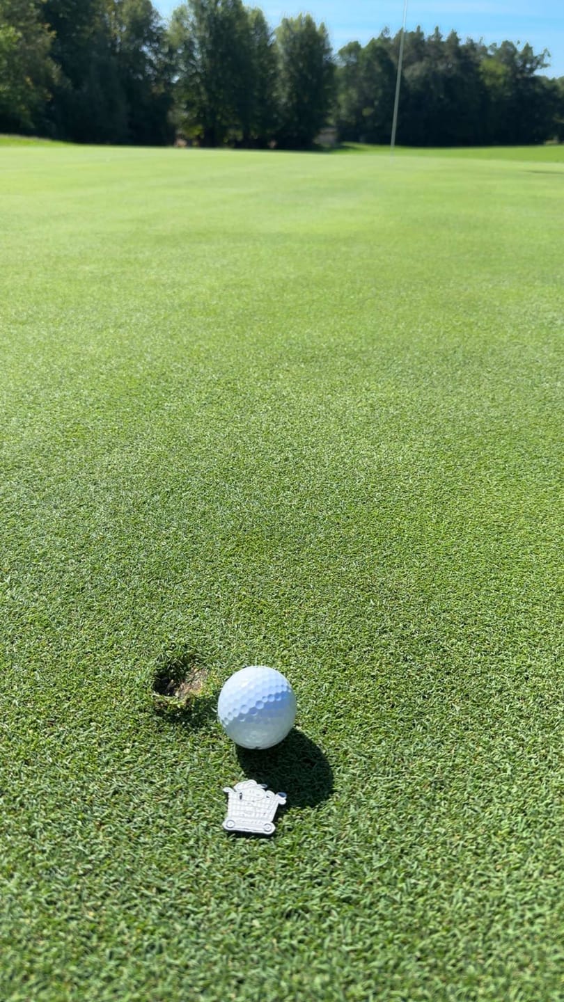 Customer photo review of Peanuts Snoopy Golf Cart Ball Marker