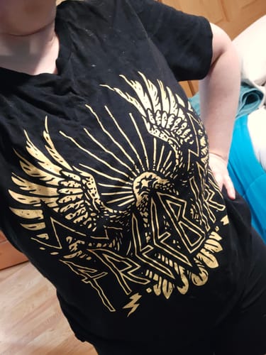 Customer's black Freebird Tee with a gold eagle graphic, showing the relaxed boyfriend fit