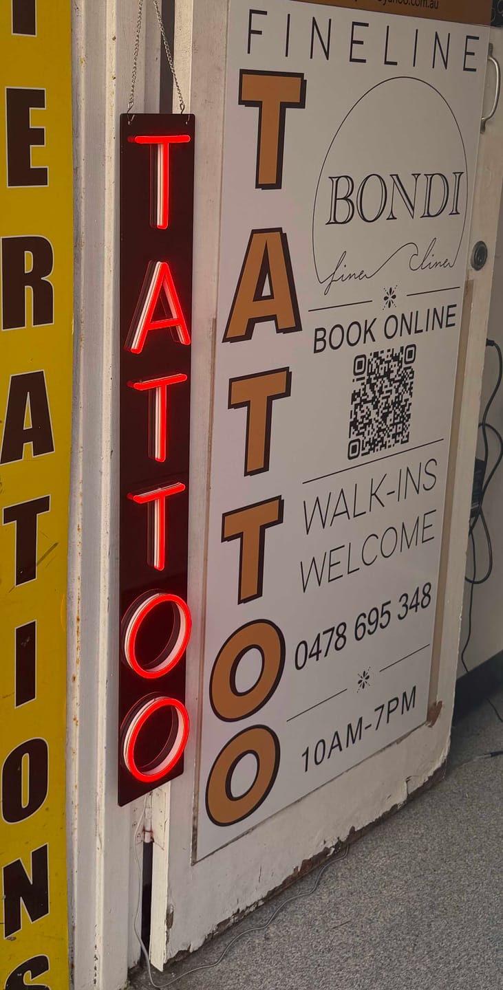 Customer photo review of Custom neon sign T A T T O O