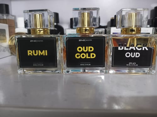 Customer's Royal Oud Collection featuring three glass perfume bottles labeled Rumi, Oud Gold, and Black Oud.