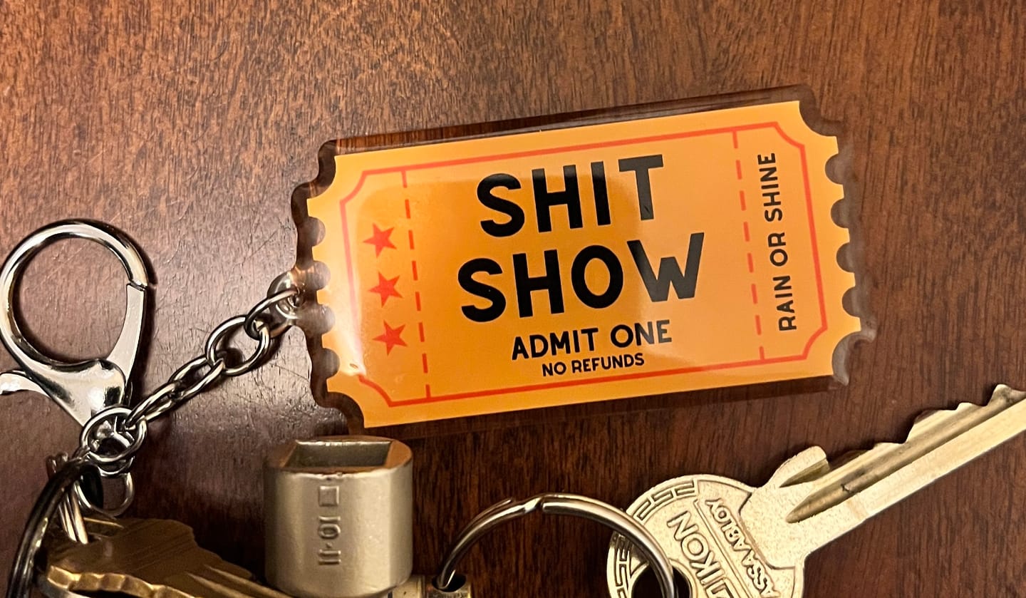 Customer photo review of Shit Show Ticket Keychain
