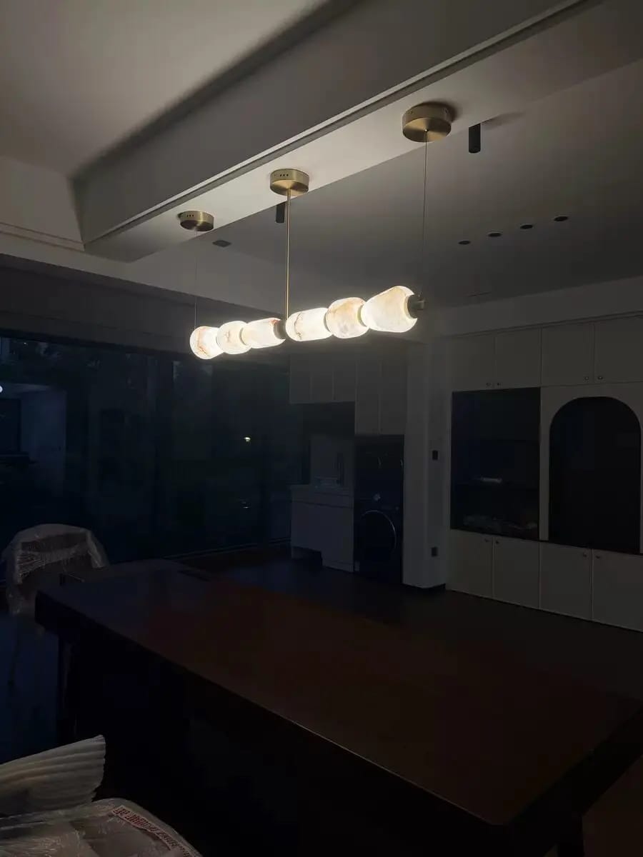 Customer photo review of Modern Natural Alabaster Linear LED Chandelier - Brass & Marble Hanging Pendant Lamp for Dining Table, Kitchen Island & Living Room