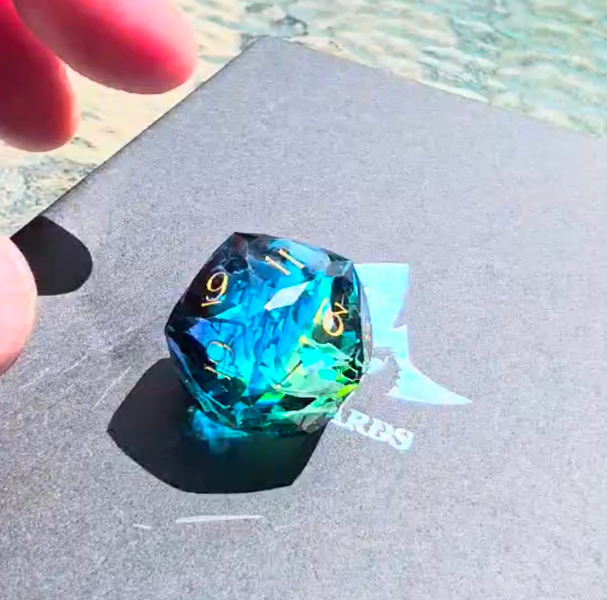 Customer photo review of URWizards D&D Resin Tidebound Fate Engraved Dice Set Multi-faceted Style