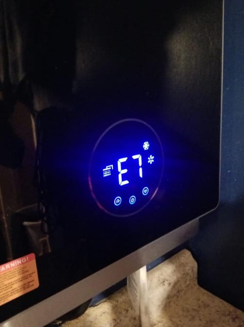 Customer photo review of 3.18 GPM Indoor Tankless Water Heater Propane with Wall Thimble, Black