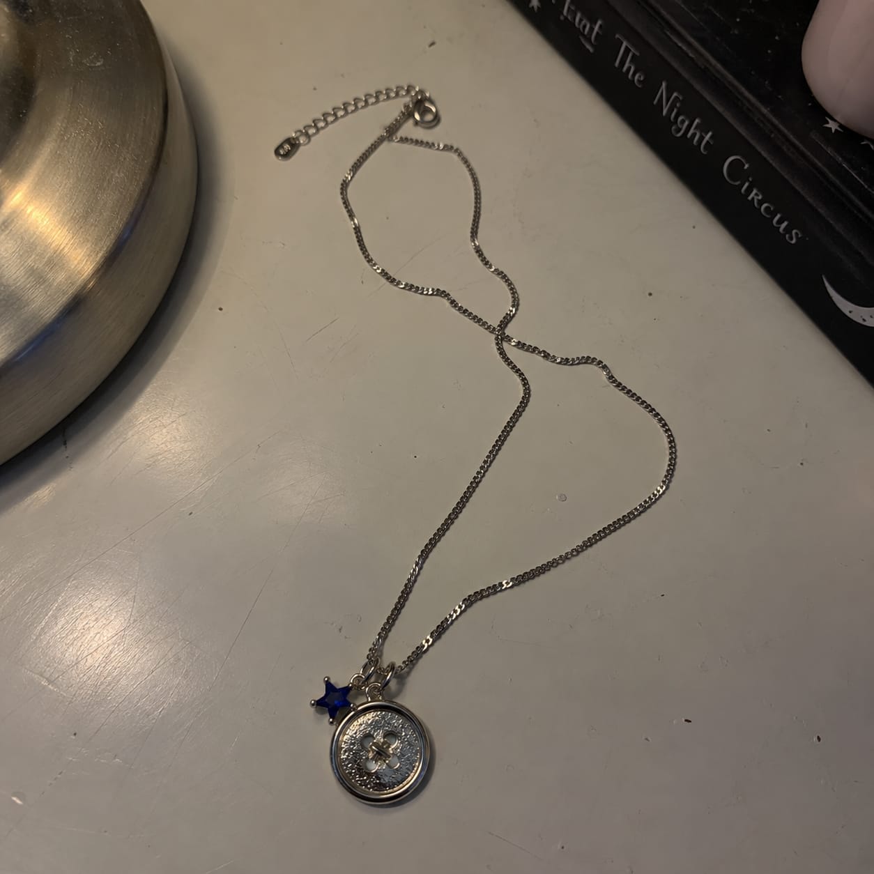 Customer photo review of LUMI x Coraline Button Necklace
