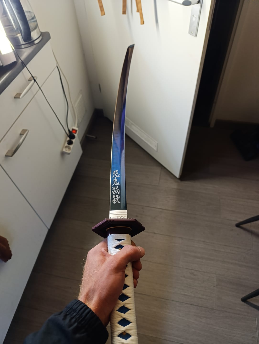 Customer photo review of The Giyuu Tomioka Handmade Katana Clay Tempered T10 Steel From Demon Slayer