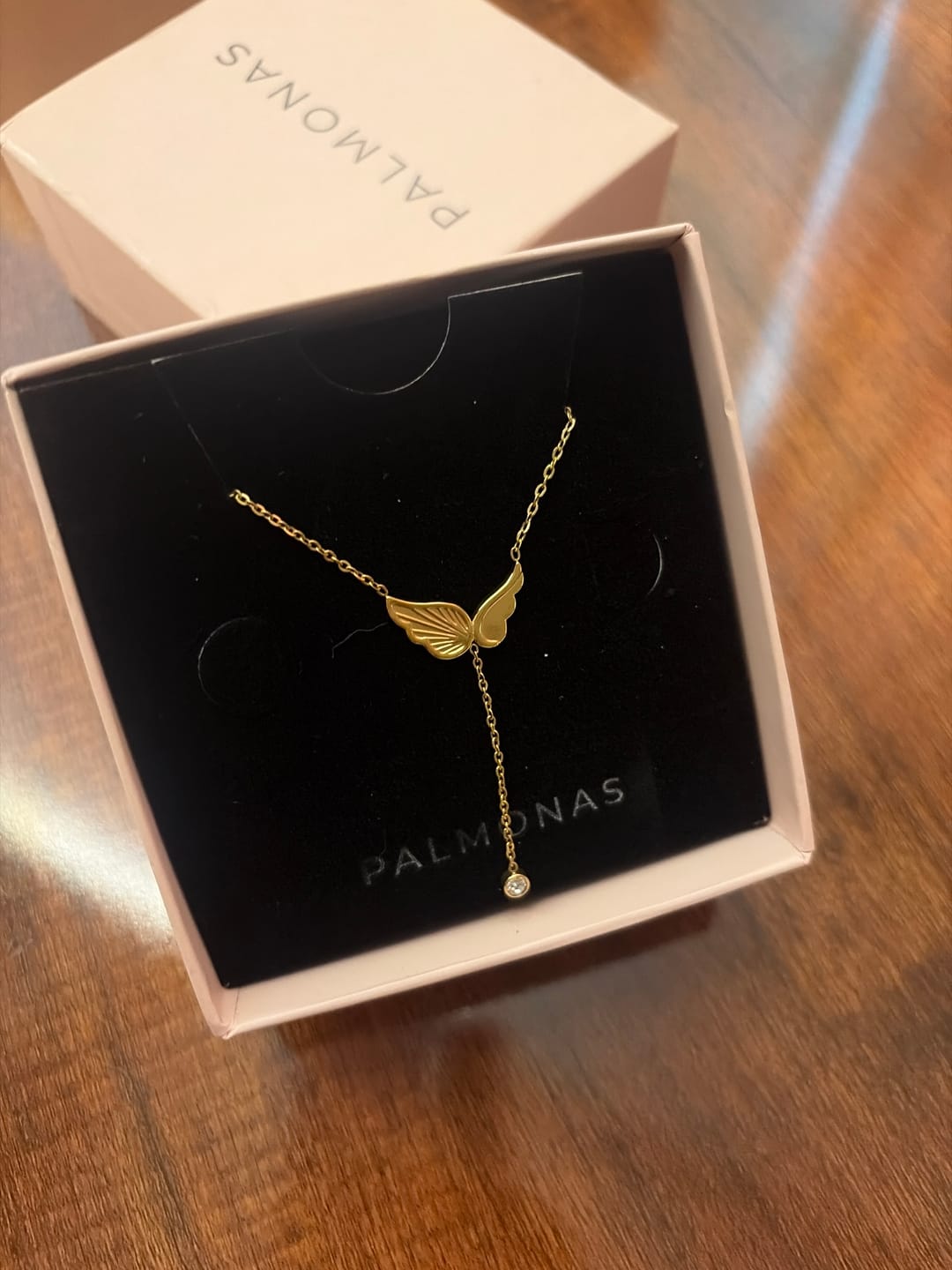 Customer photo review of Angel Wing Dangling Diamond Necklace